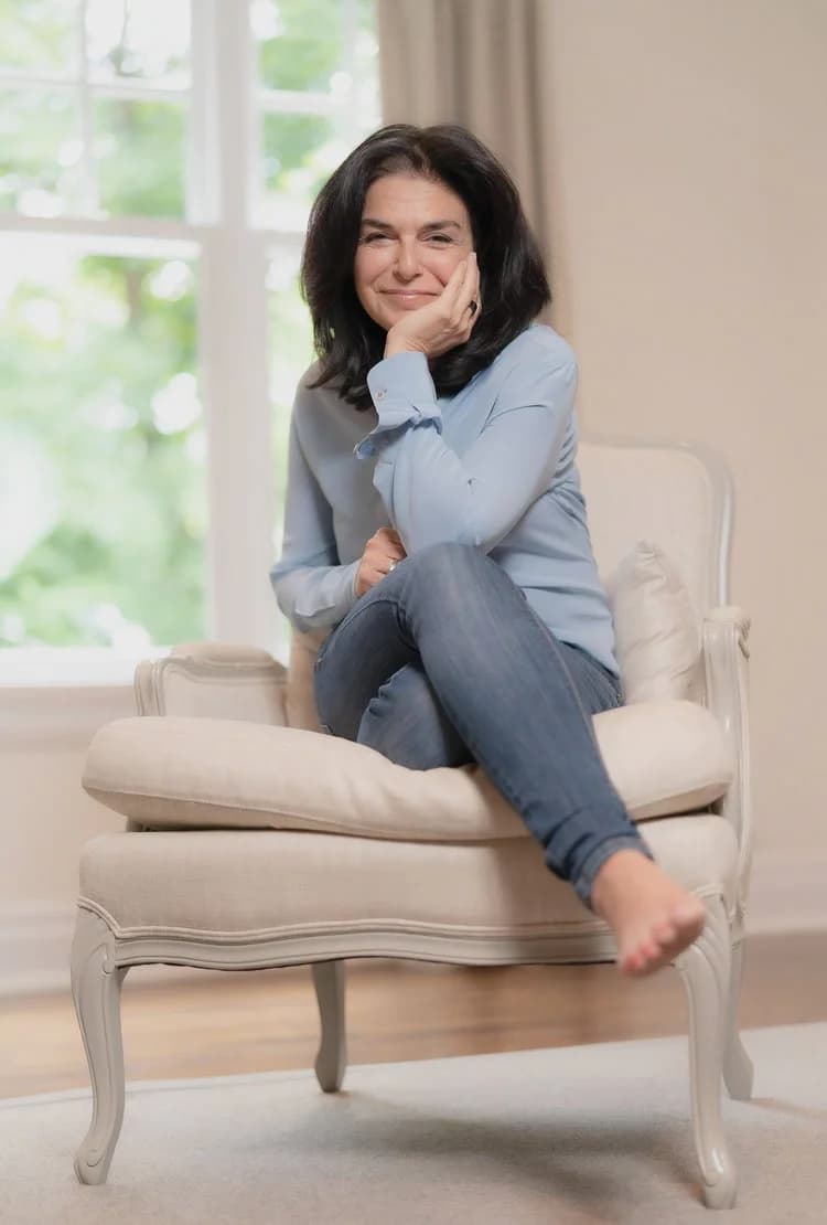 Nathalie Niddam sitting casually in a chair